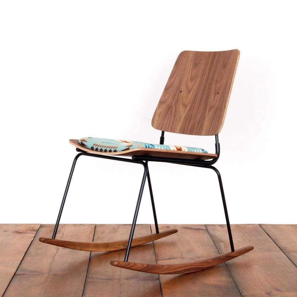 a molded plywood chair with no arm rests and with a Pendleton seat cushion