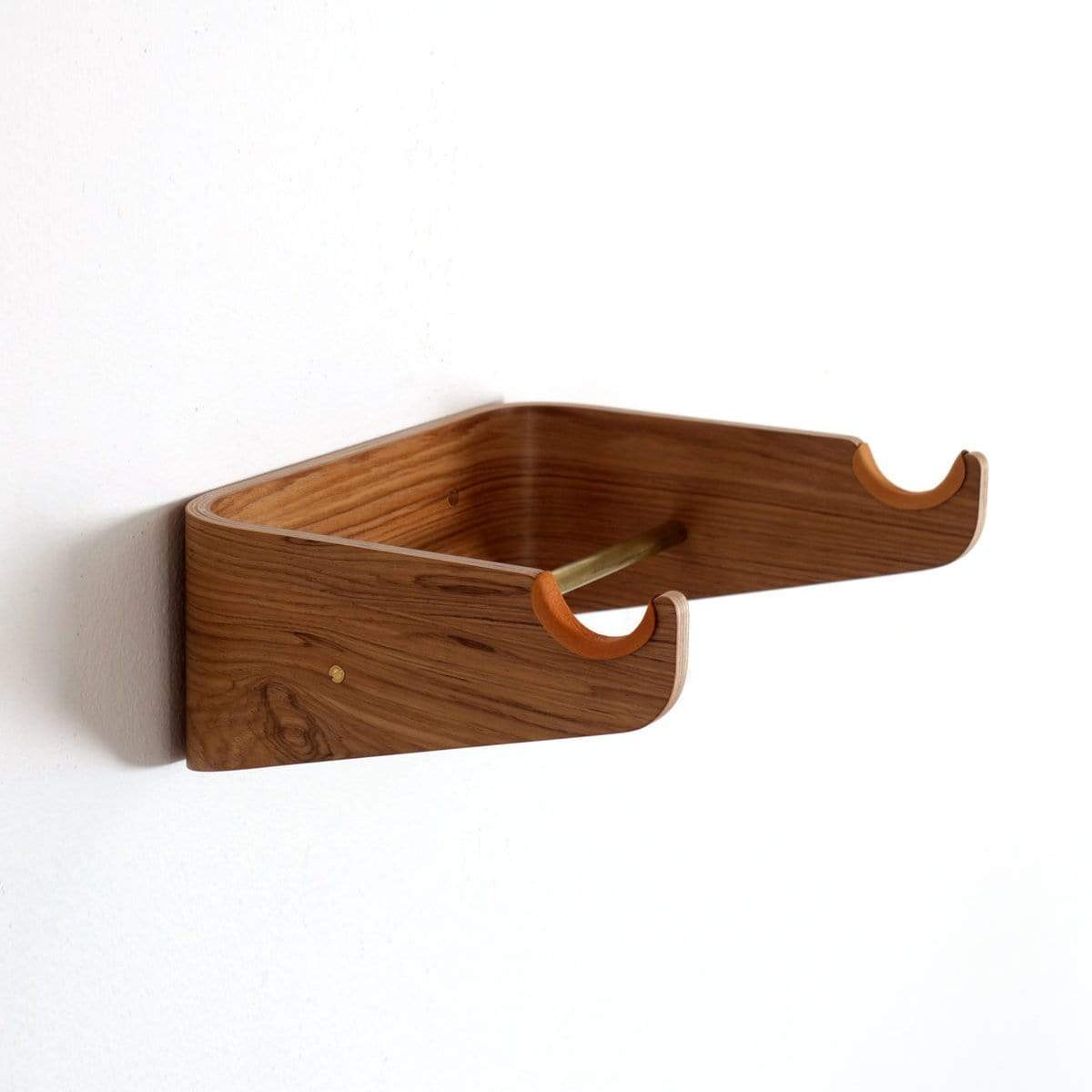 Angled side of a wooden wall hanger for bikes