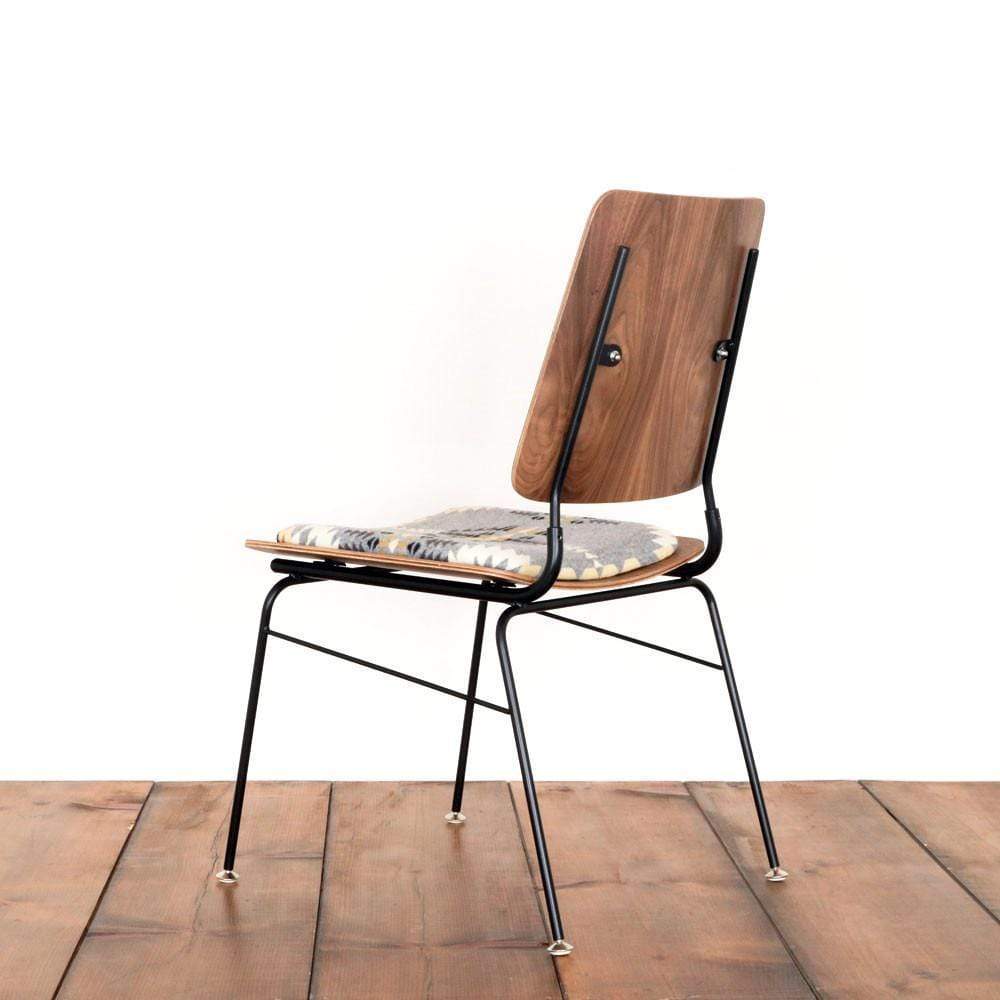 The back of a molded plywood chair