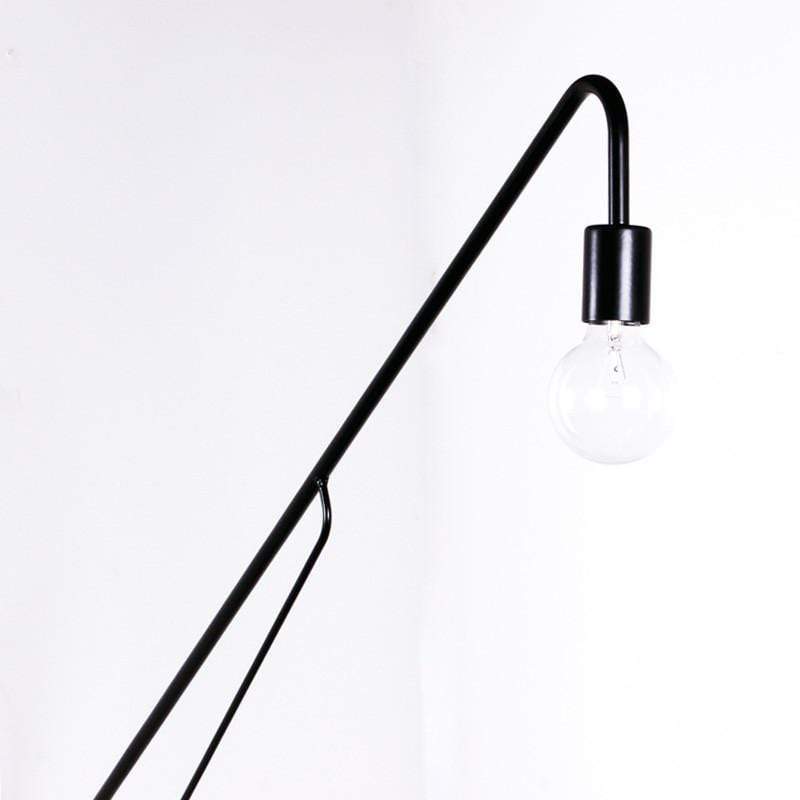 Metal long arm black wall lamp with a single bulb at the end