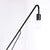 Metal long arm black wall lamp with a single bulb at the end