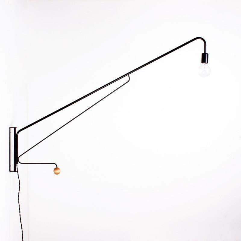 Metal long arm black wall lamp with a single bulb at the end